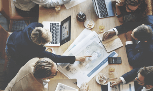 Colleagues collaborating around a desk