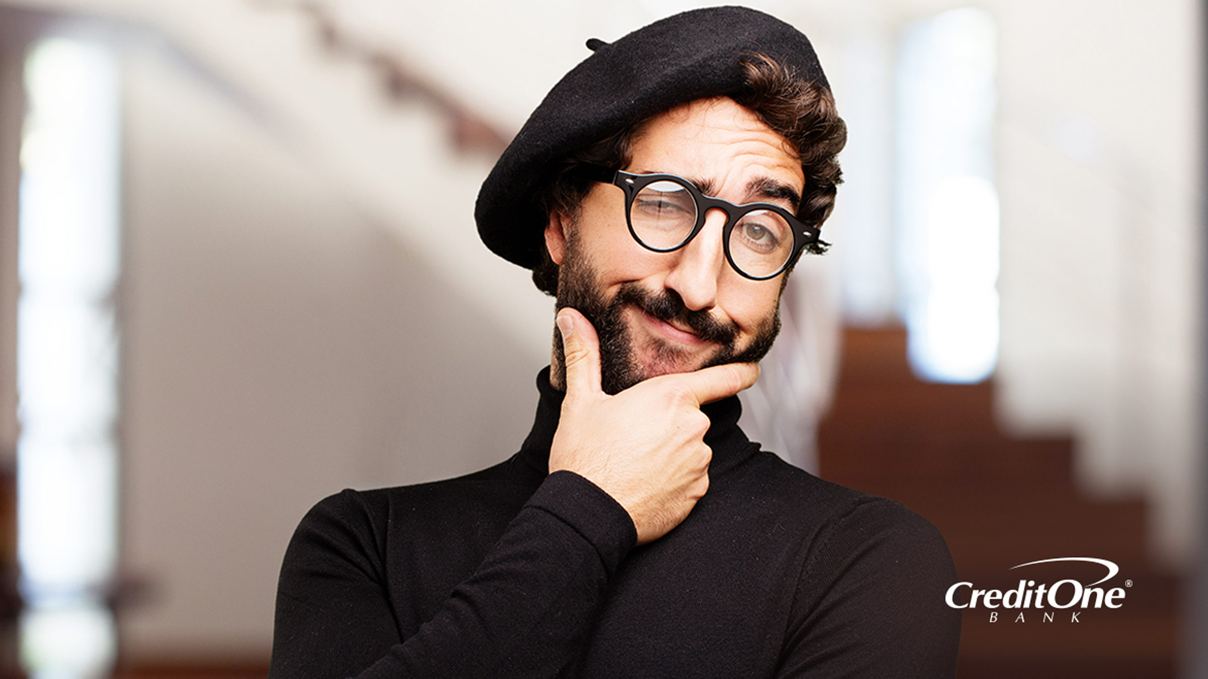 A man with his hand on his chin with a thinking expression