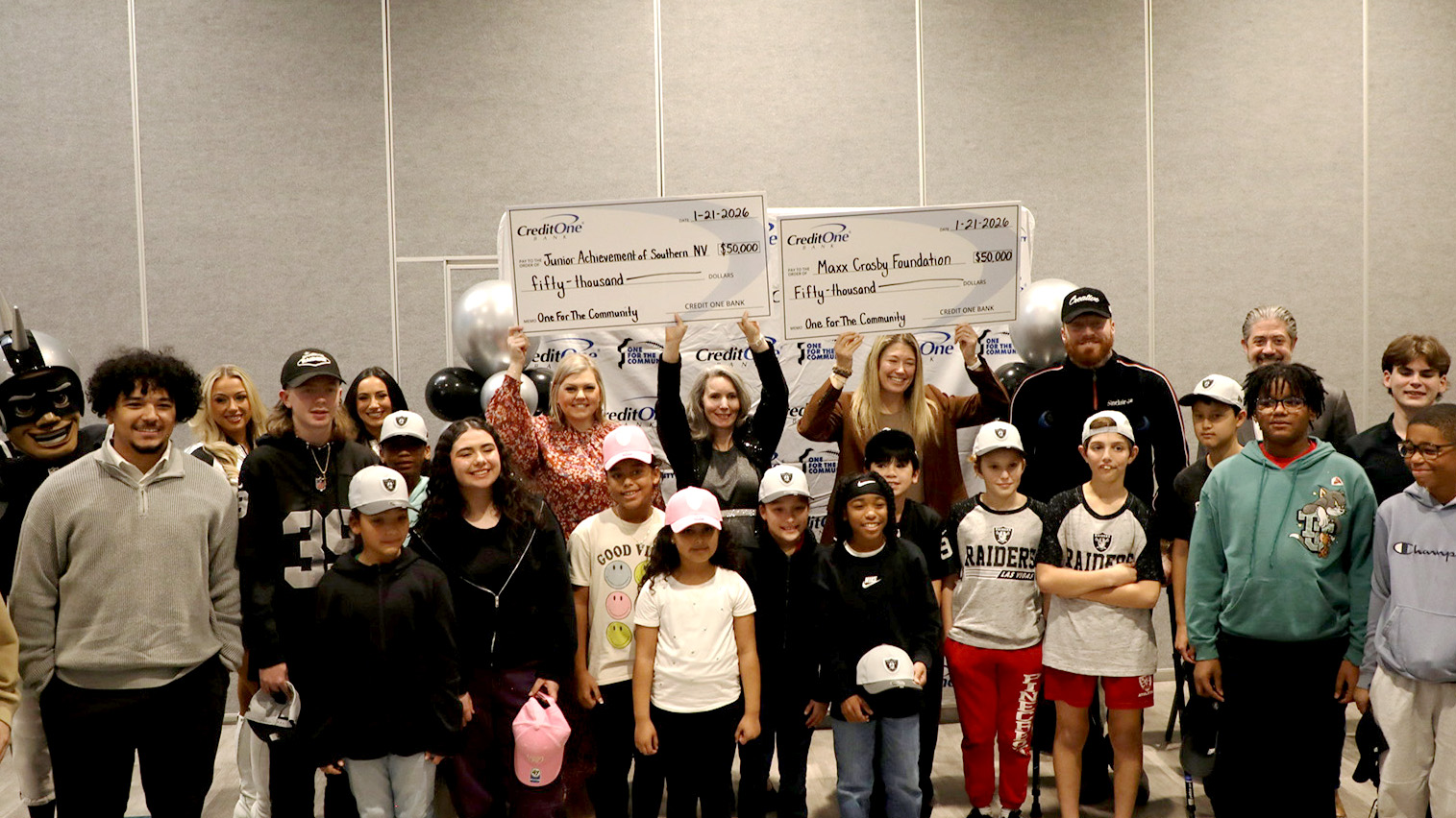 One For The Community check presentation event