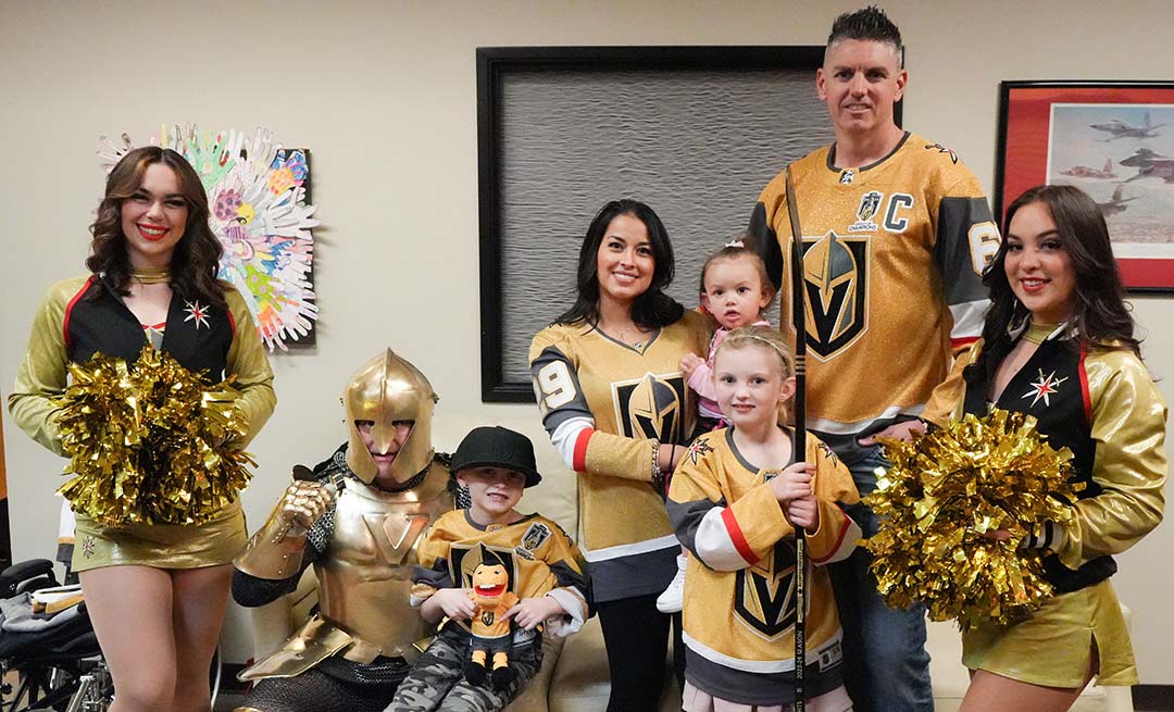 Two families from Candlelighters Childhood Cancer Foundation at the Vegas Golden Knights game with Credit One Bank